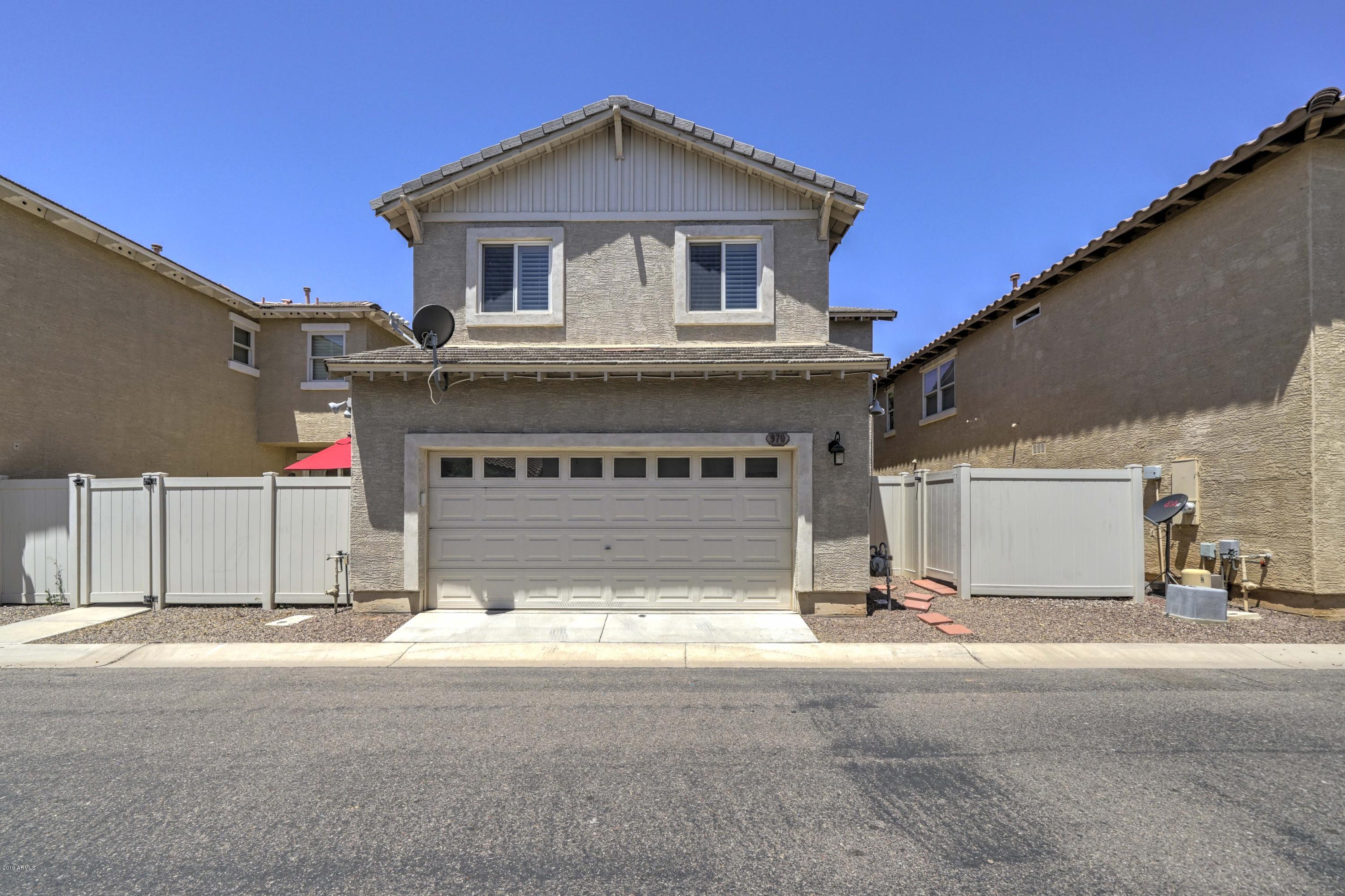 970 South Henry Lane Gilbert, AZ 85296 - Photo 21 of 51 a front view of a house with a garage