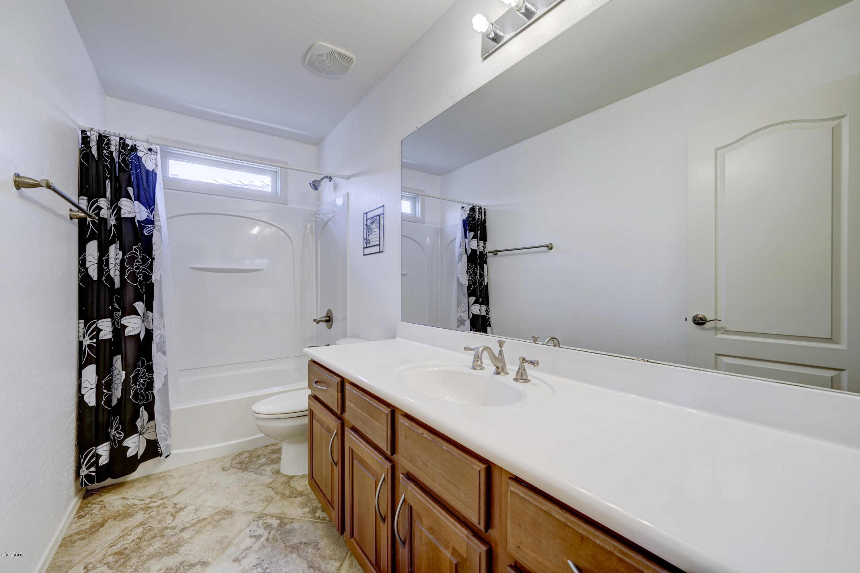 970 South Henry Lane Gilbert, AZ 85296 - Photo 22 of 51 a bathroom with a double vanity sink a toilet and a shower