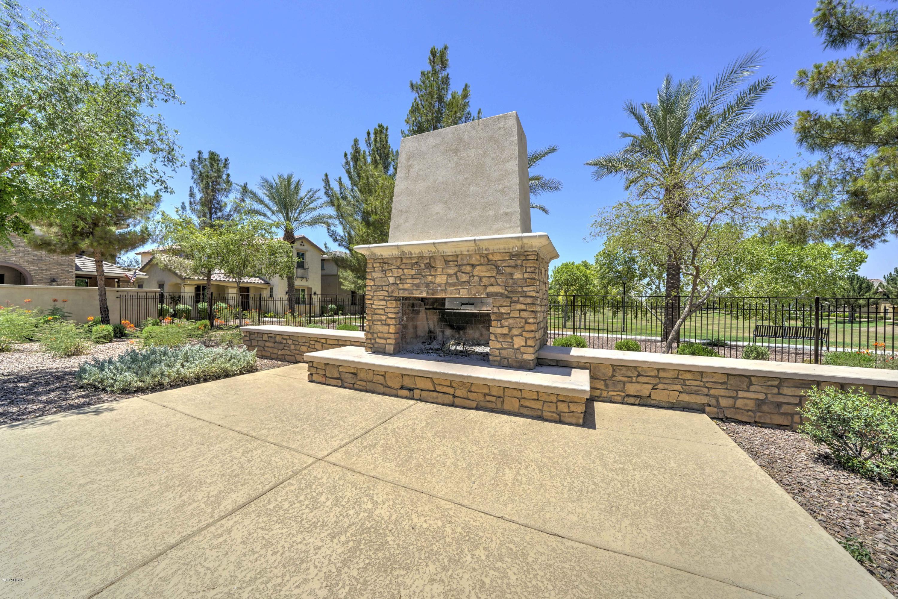 970 South Henry Lane Gilbert, AZ 85296 - Photo 26 of 51 a view of a house with a yard and a fountain