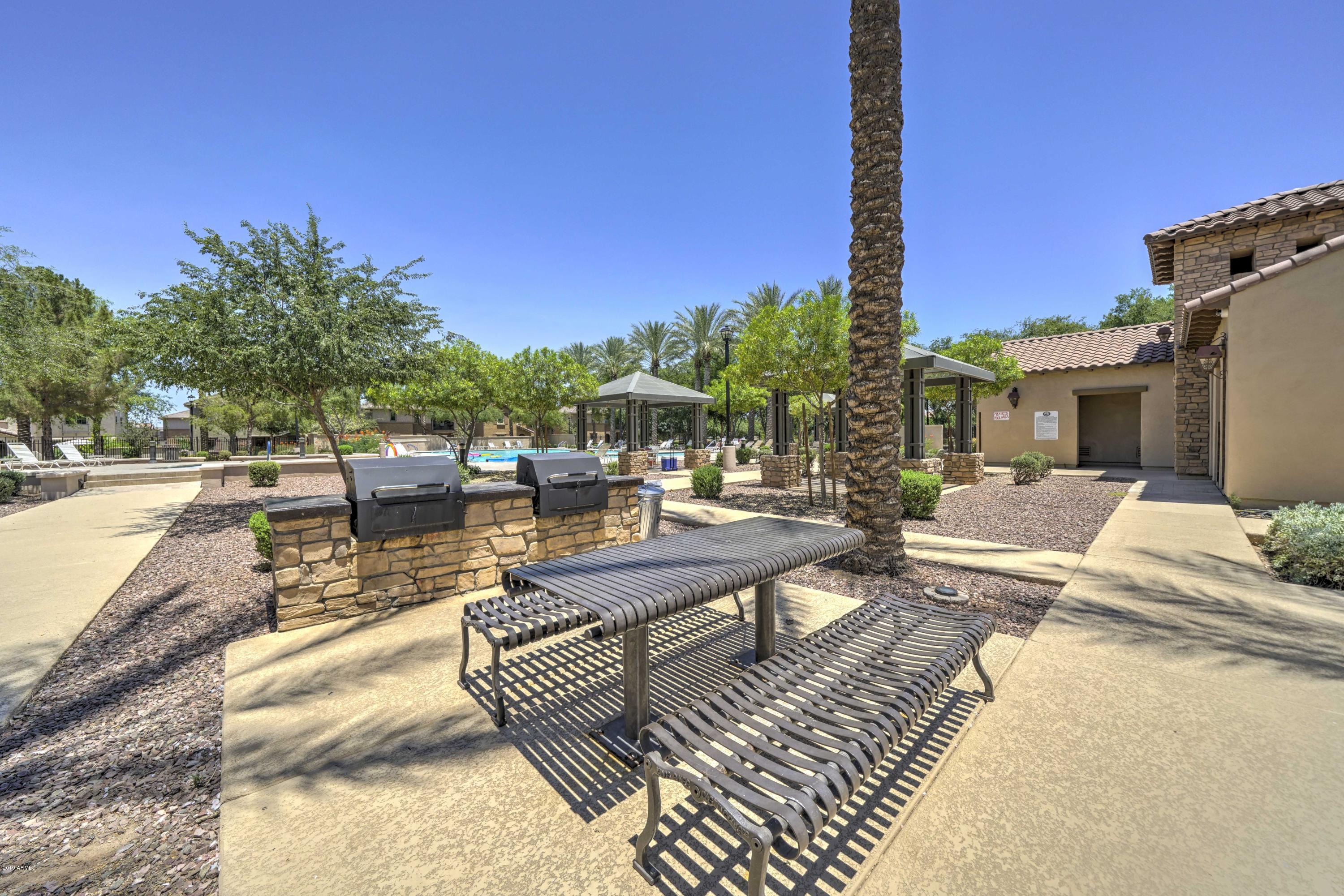 970 South Henry Lane Gilbert, AZ 85296 - Photo 27 of 51 a view of a patio with couches and potted plants