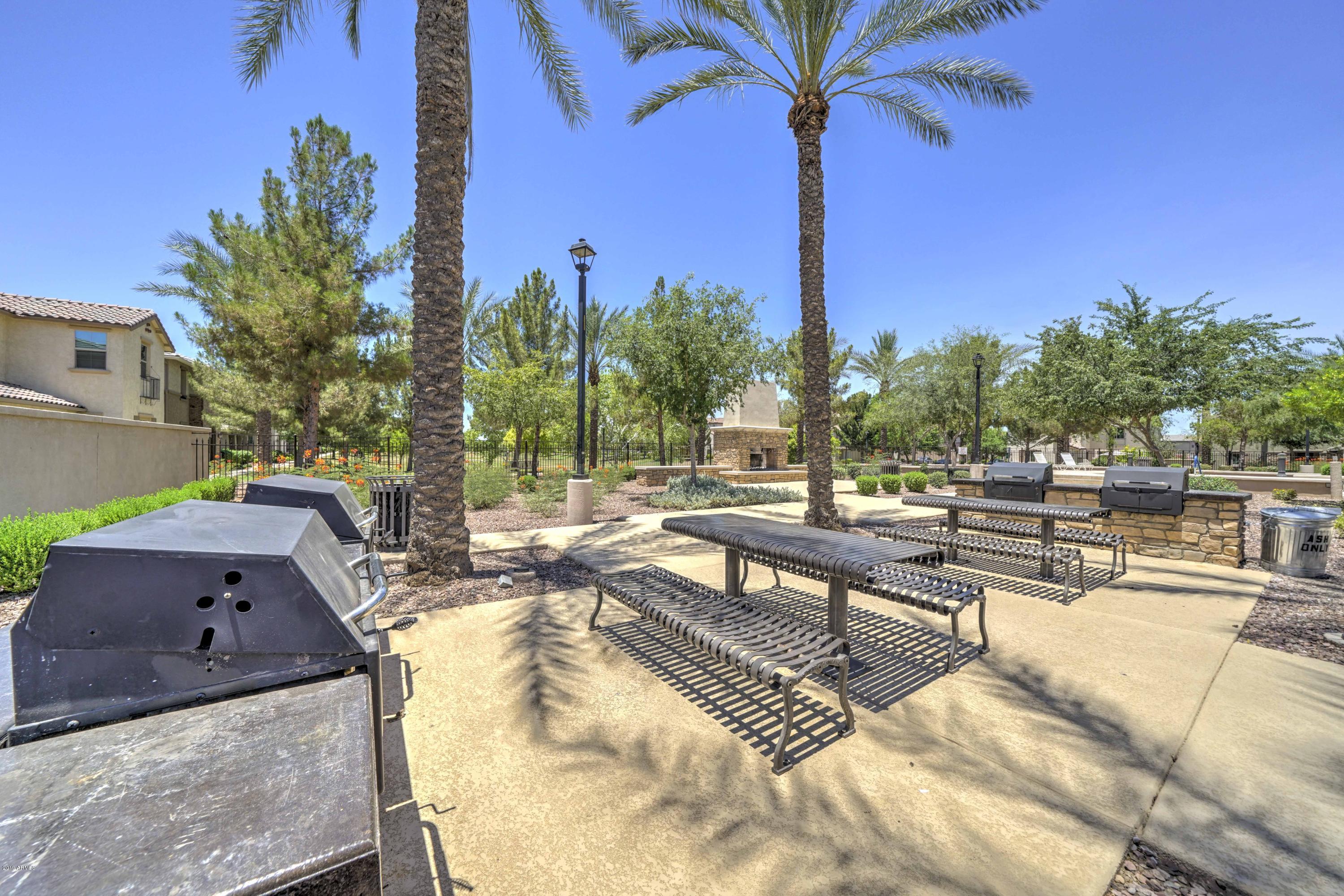 970 South Henry Lane Gilbert, AZ 85296 - Photo 28 of 51 a view of a swimming pool with a patio and a yard