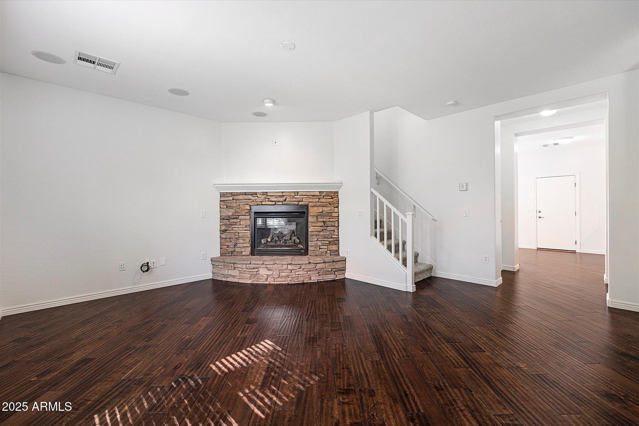 970 South Henry Lane Gilbert, AZ 85296 - Photo 32 of 51 a view of an empty room with wooden floor and a window