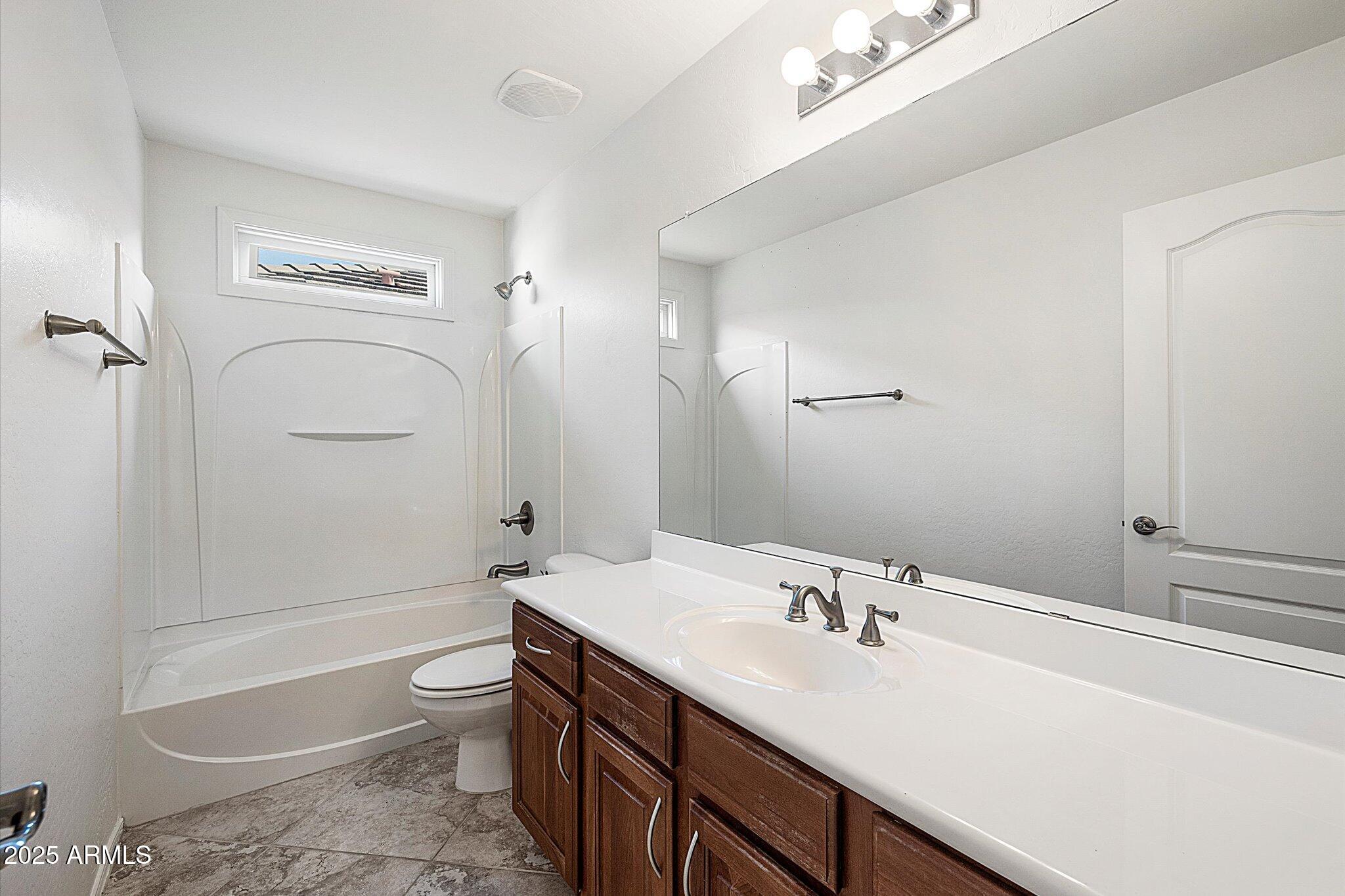970 South Henry Lane Gilbert, AZ 85296 - Photo 42 of 51 a bathroom with a sink a toilet and shower