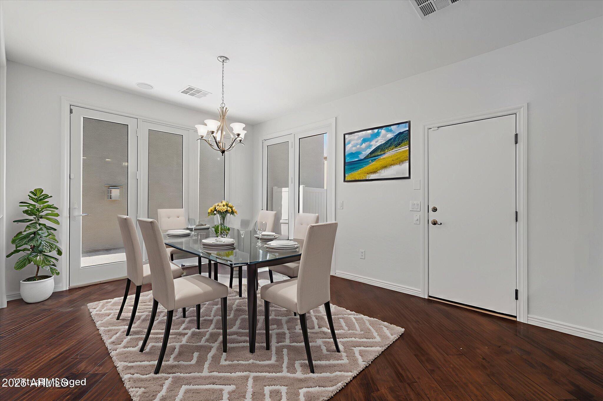 970 South Henry Lane Gilbert, AZ 85296 - Photo 6 of 51 a view of a dining room with furniture wooden floor and chandelier