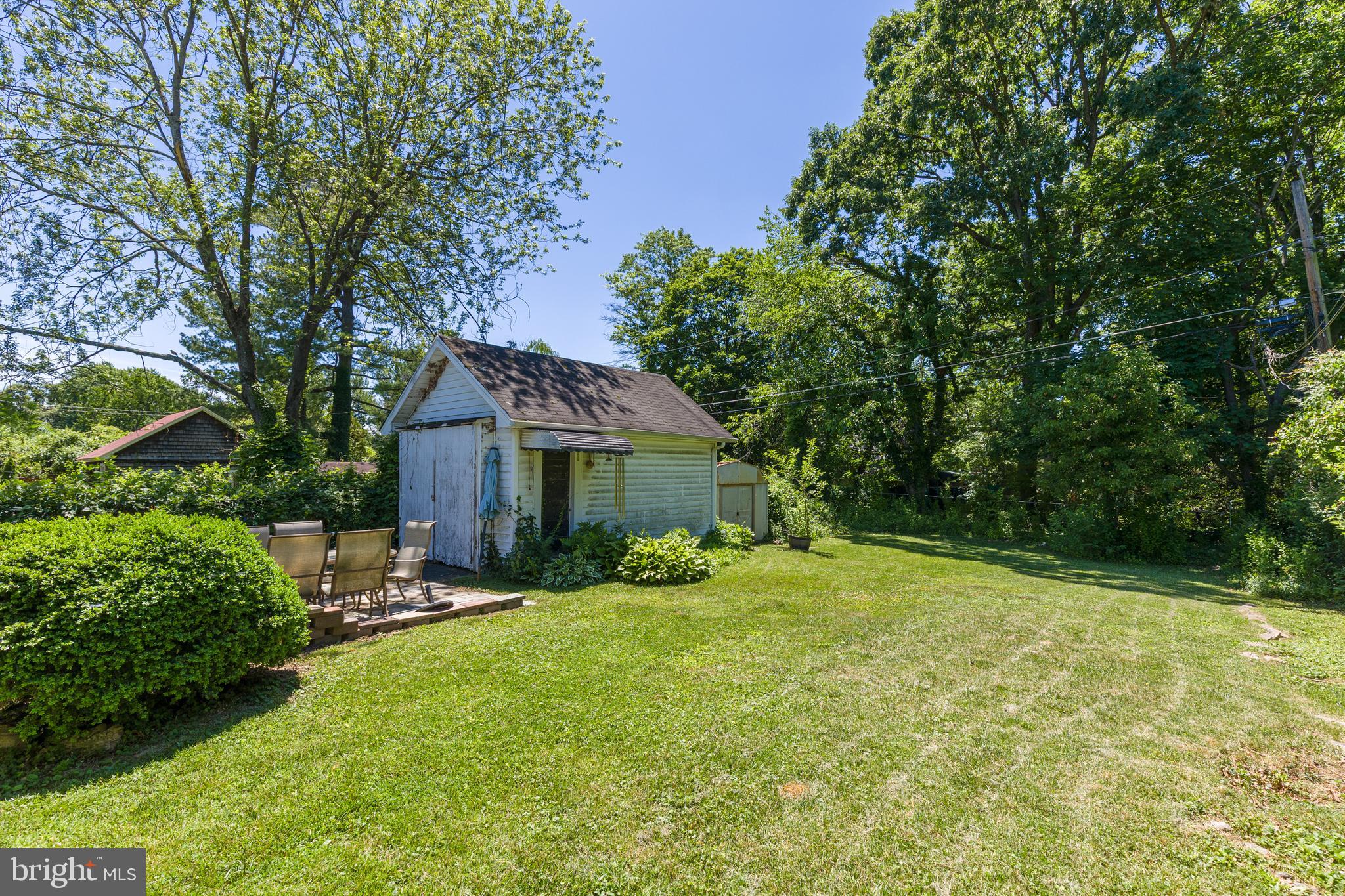 6426 Sherwood Road Baltimore, MD 21239 - Photo 39 of 43 a view of a house with backyard garden and sitting area