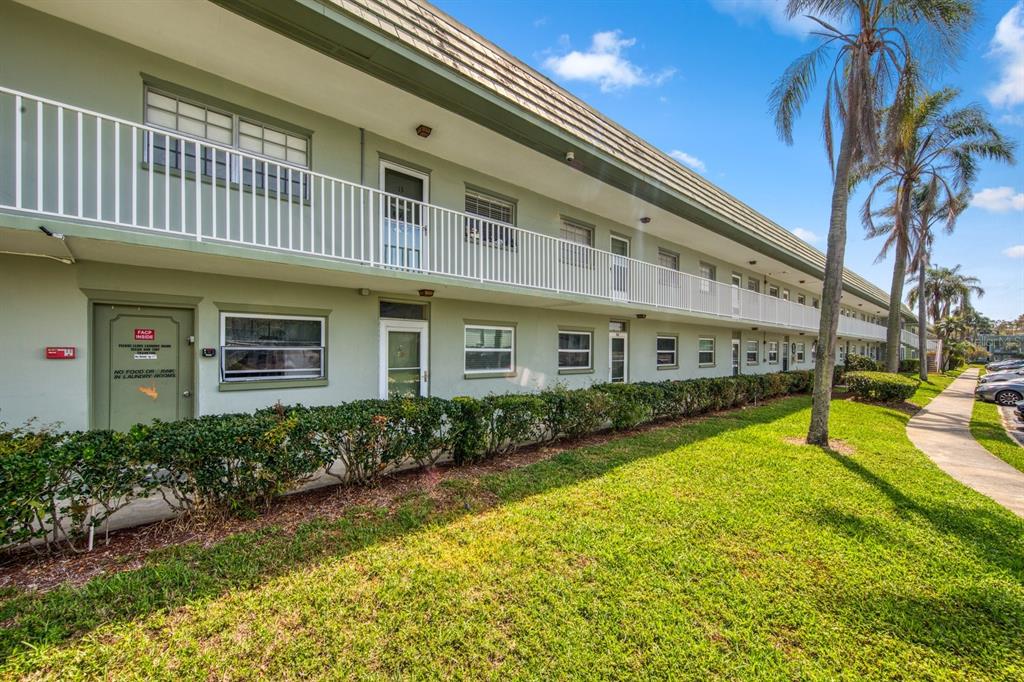1433 South Belcher Road, Unit F3 Clearwater, FL 33764 - Photo 1 of 1 a view of a house with a swimming pool