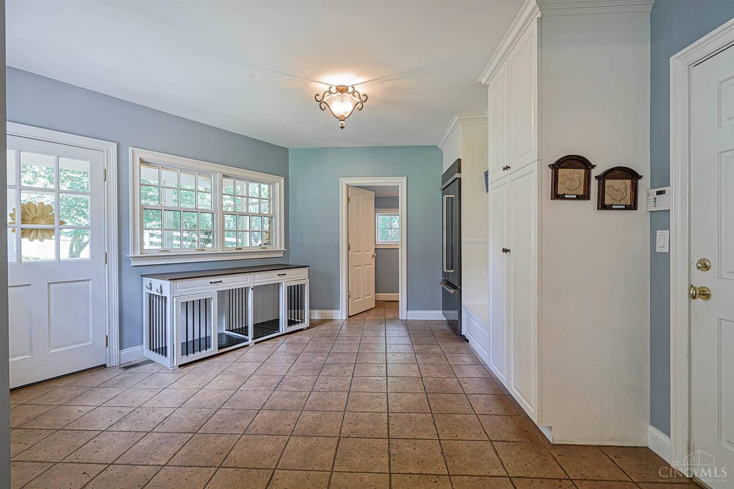 8205 Kroger Farm Road Cincinnati, OH 45243 - Photo 14 of 76 Mudroom with Half Bath, access to Screened Porch and Garage