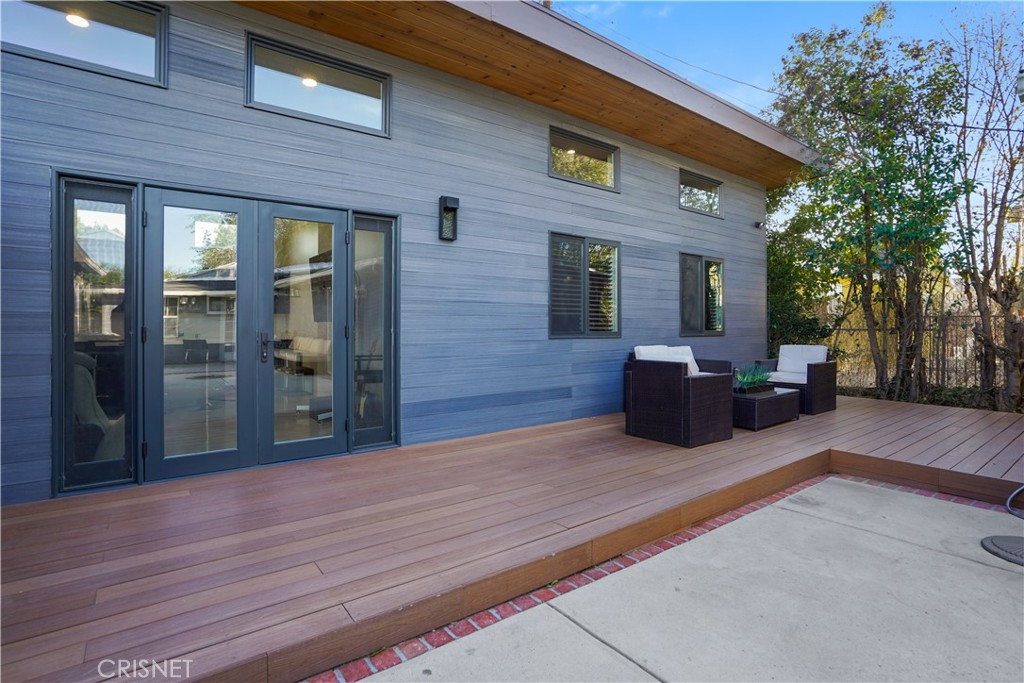 22026-22028 Valerio Street Canoga Park, CA 91303 - Photo 1 of 43 a view of a house with a patio