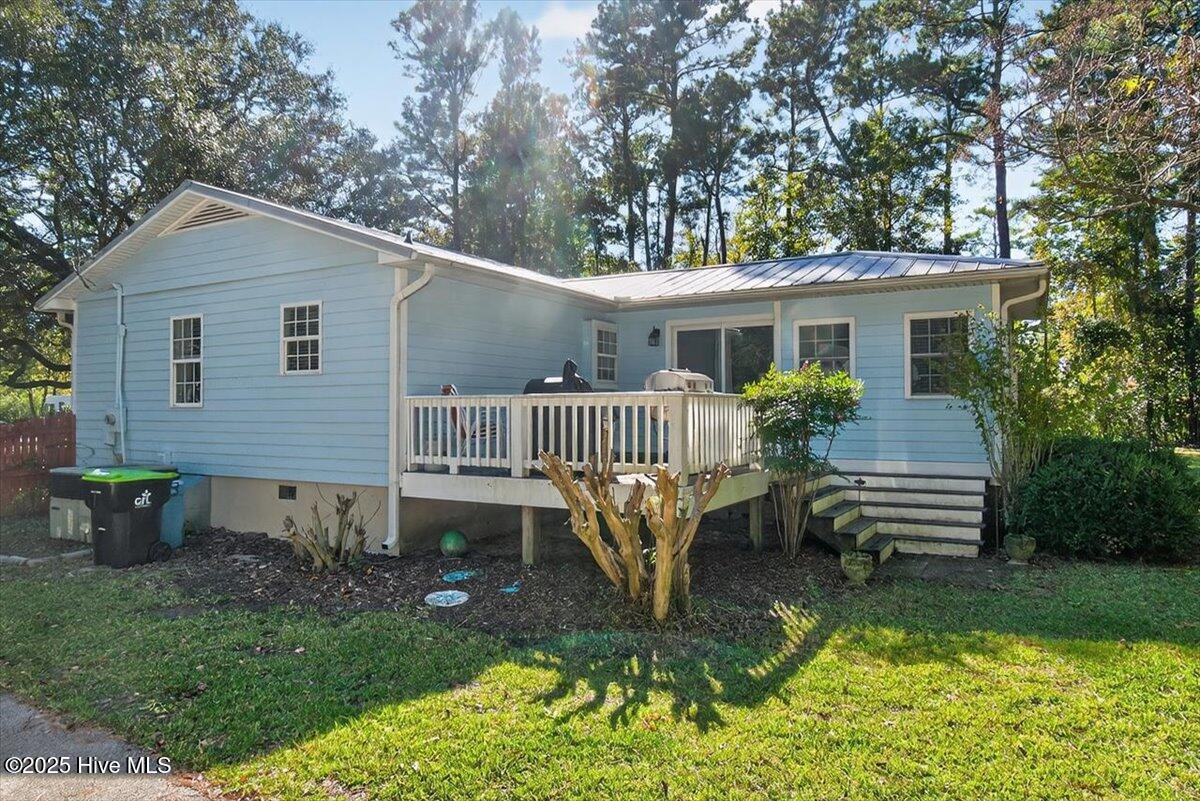 1109 Middle Sound Loop Road Wilmington, NC 28411 - Photo 10 of 49 Deck leading into the sunroom
