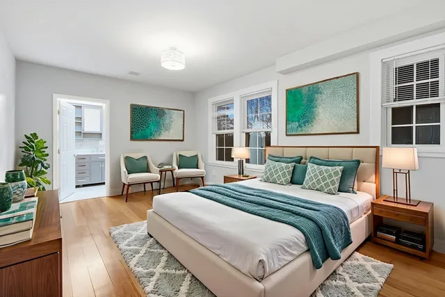 a bedroom with bed and a couch