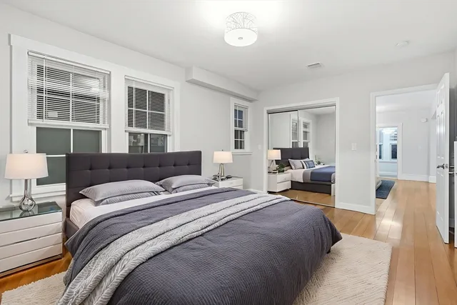 a hotel room with large bed and a couch