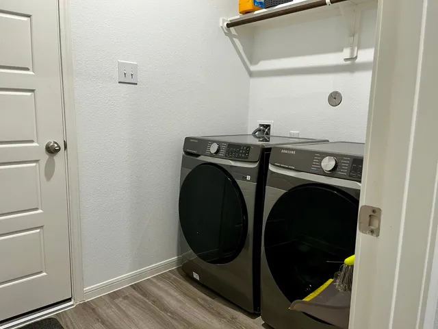 a utility room with dryer and washer