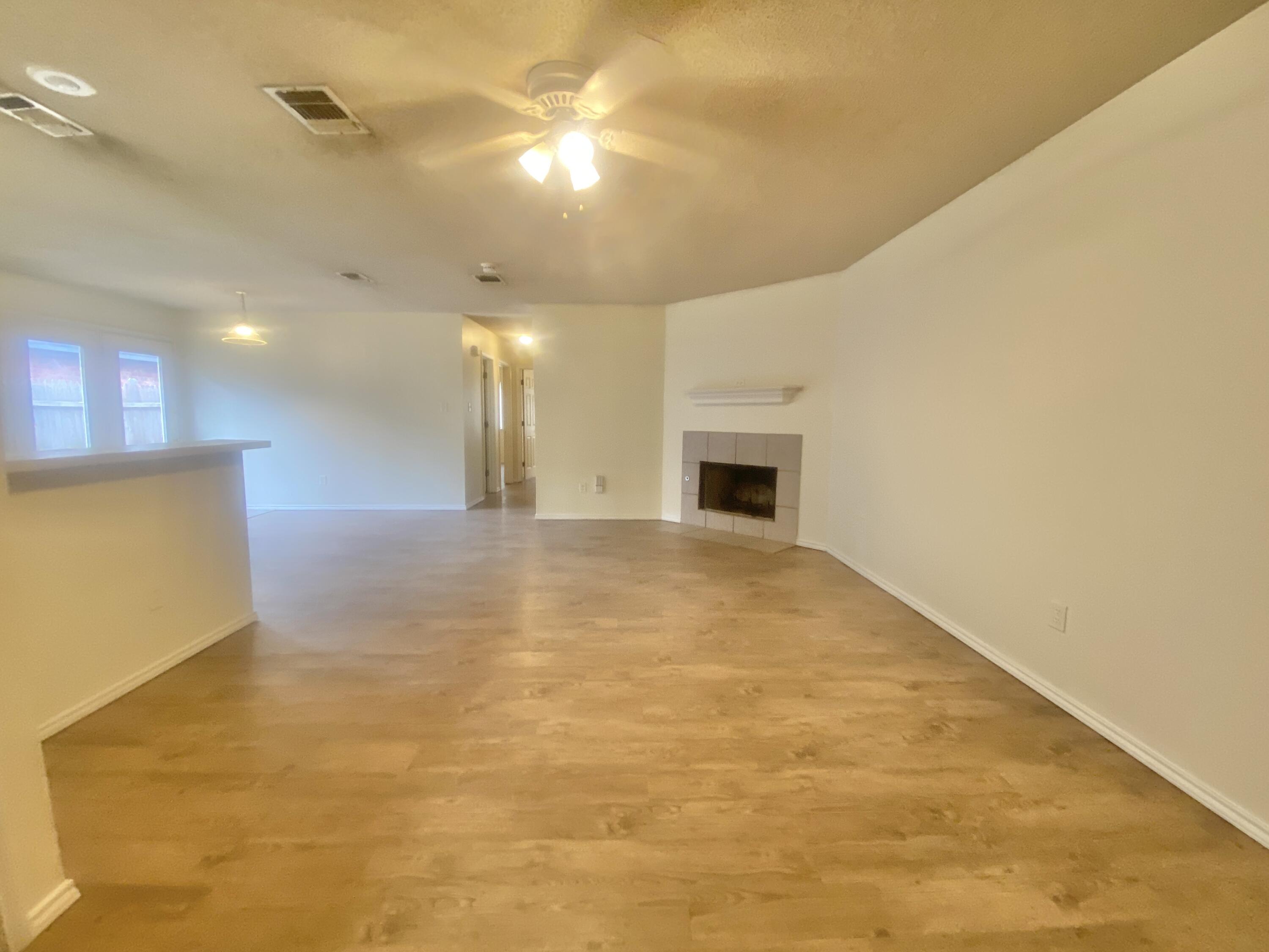6319 7th Street Lubbock, TX 79416 - Photo 2 of 14 a view of empty room with wooden floor