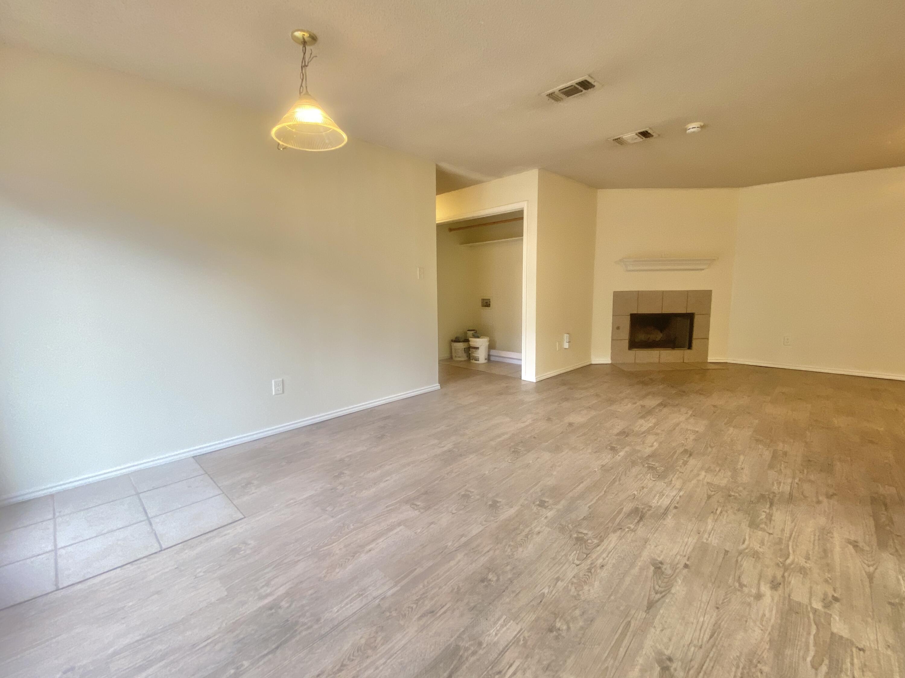 6319 7th Street Lubbock, TX 79416 - Photo 3 of 14 a view of empty room with a fireplace