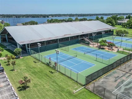 a view of a backyard with a patio and fire pit