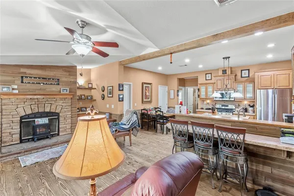 a living room with furniture a dining table and chairs