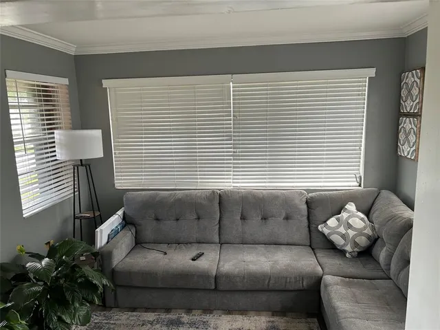 a living room with furniture and a window