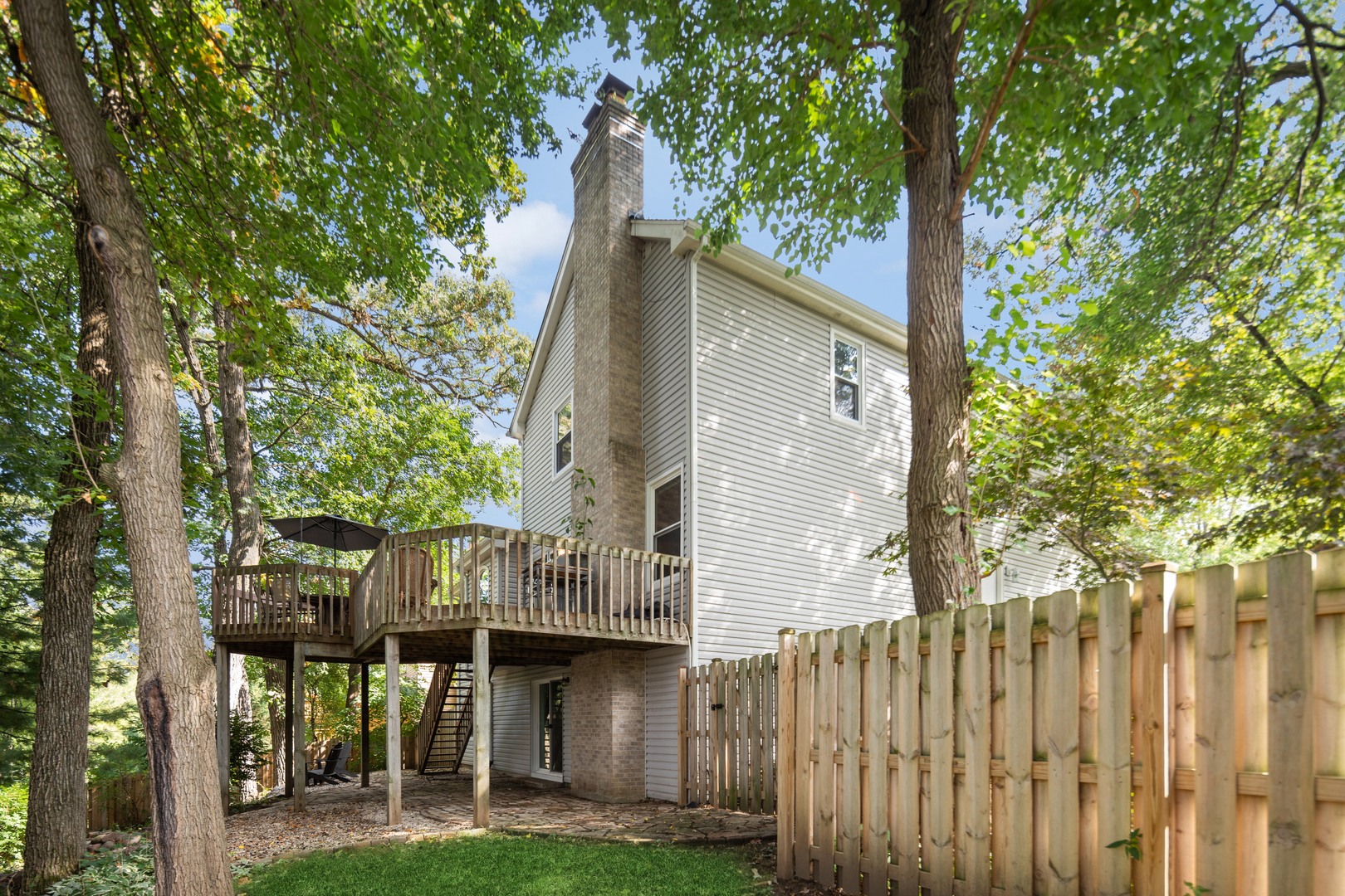 409 Hunters Way Fox River Grove, IL 60021 - Photo 22 of 22 a front view of a house with garden