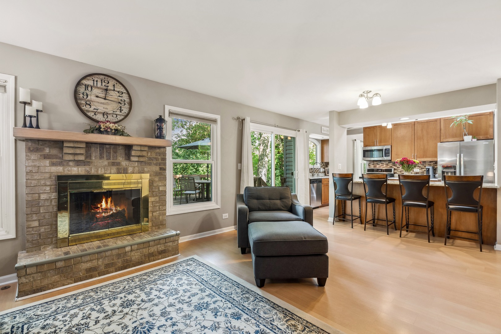 409 Hunters Way Fox River Grove, IL 60021 - Photo 8 of 22 a living room with furniture a large window and a fireplace