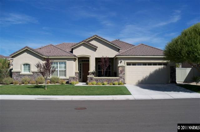 1675 Silver Thread Drive Reno, NV 89521 - Photo 1 of 13 a front view of a house with a yard and garage