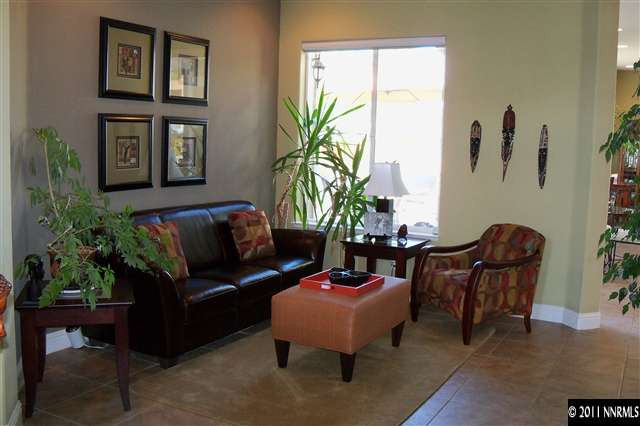 1675 Silver Thread Drive Reno, NV 89521 - Photo 8 of 13 a living room with furniture and a potted plant