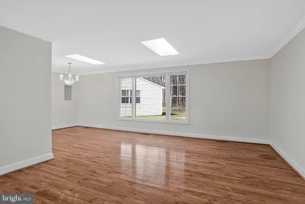 a view of empty room with fireplace