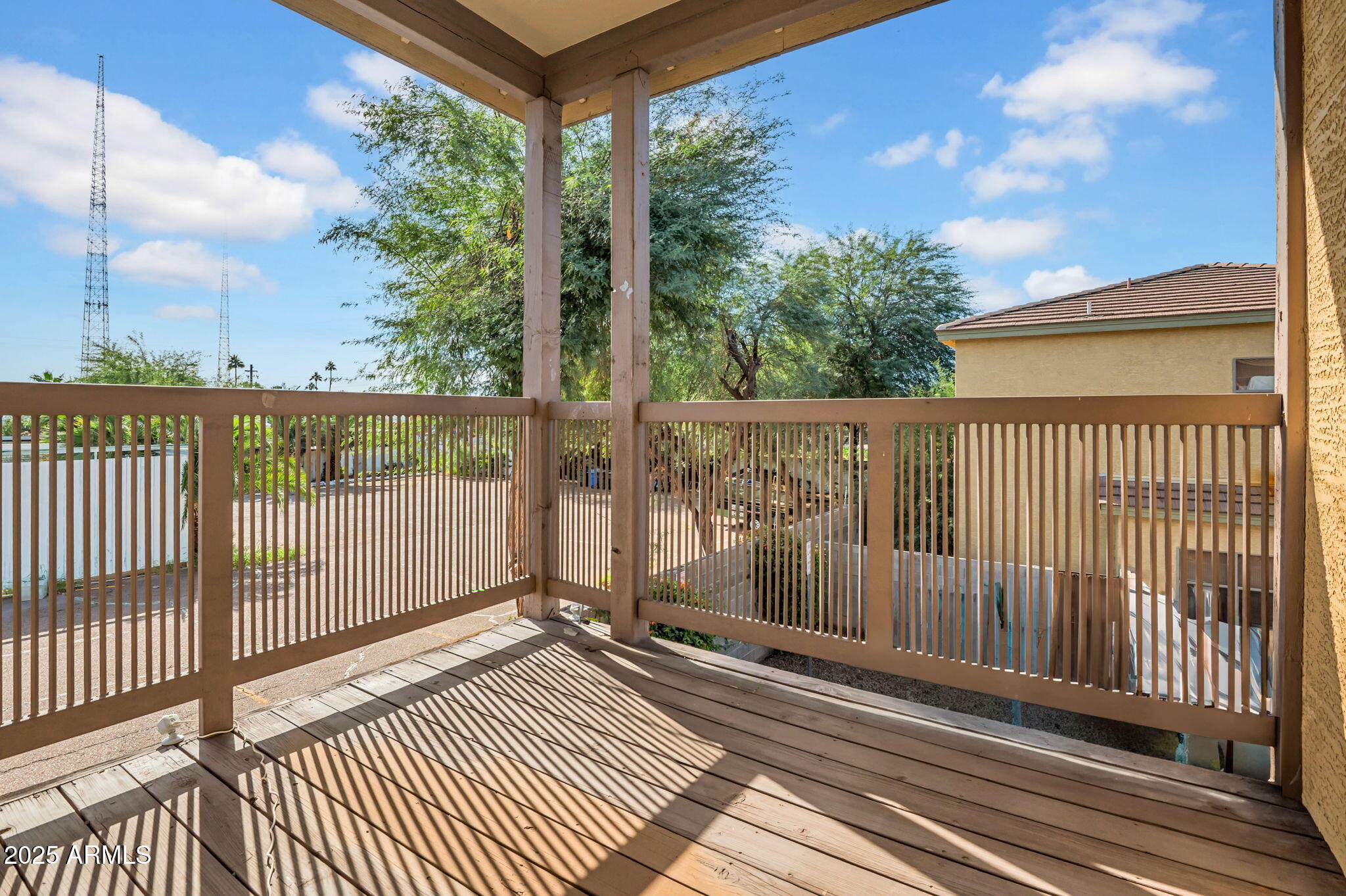 2929 North 37th Street, Unit 10 Phoenix, AZ 85018 - Photo 10 of 18 a view of a balcony with wooden floor