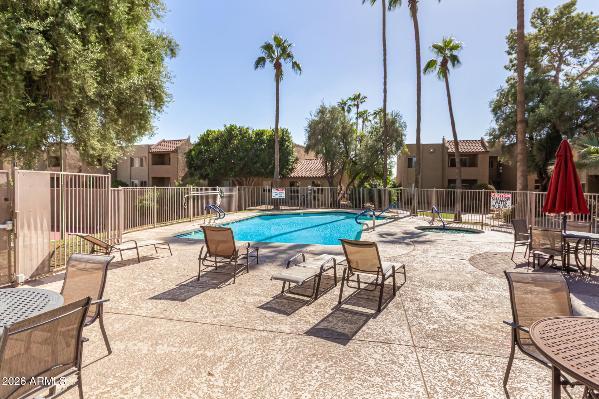 5877 North Granite Reef Road, Unit 1133 Scottsdale, AZ 85250 - Photo 32 of 33 a swimming pool with outdoor seating and yard