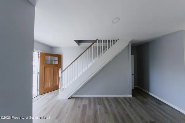 a view of entryway with wooden floor