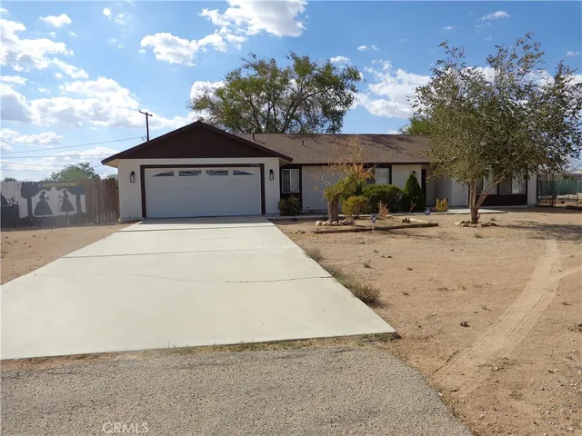 a house with trees in the background