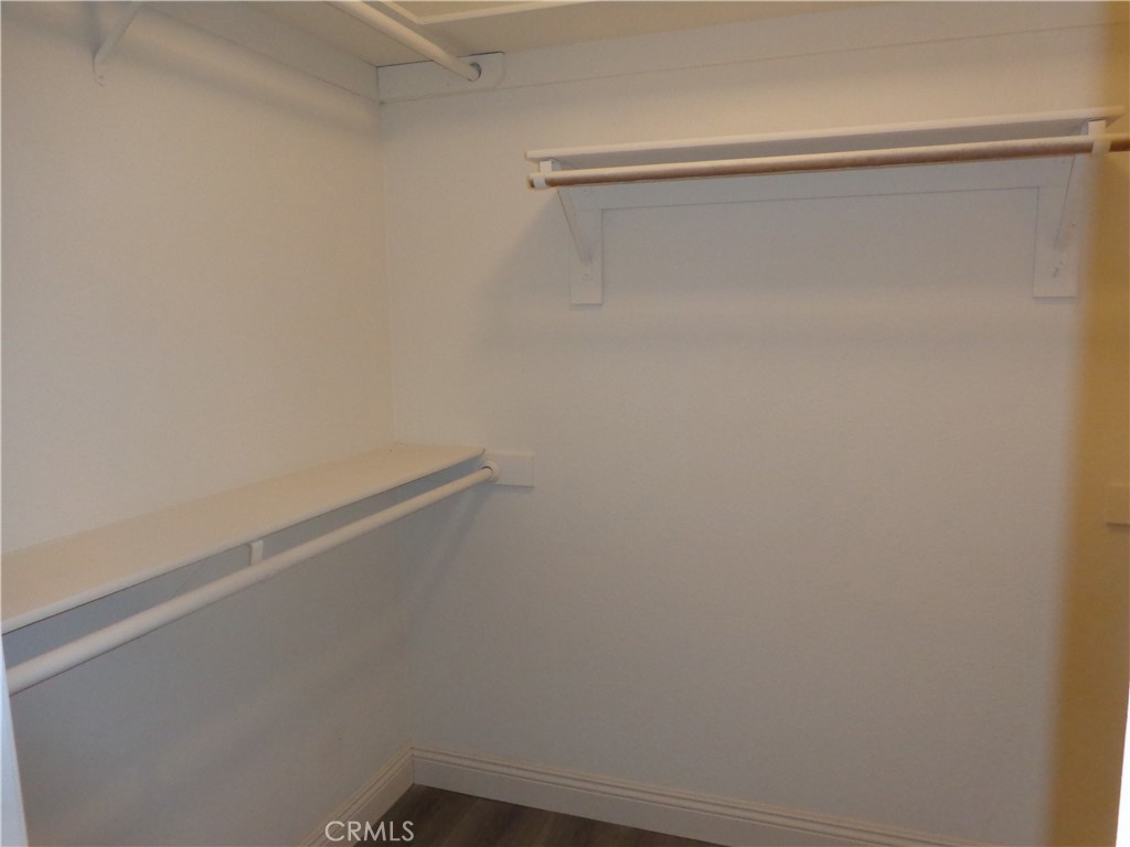 12744 Running Deer Road Apple Valley, CA 92308 - Photo 15 of 30 a view of a room with racks on the wall