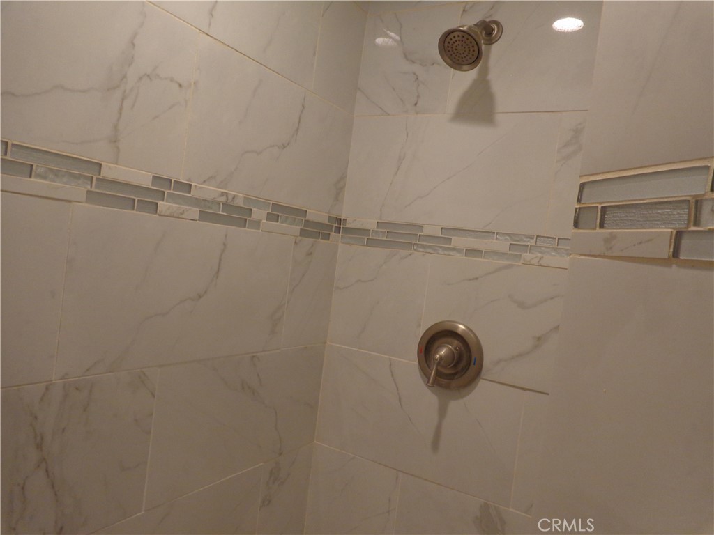 12744 Running Deer Road Apple Valley, CA 92308 - Photo 20 of 30 a close view of a shower in the bathroom