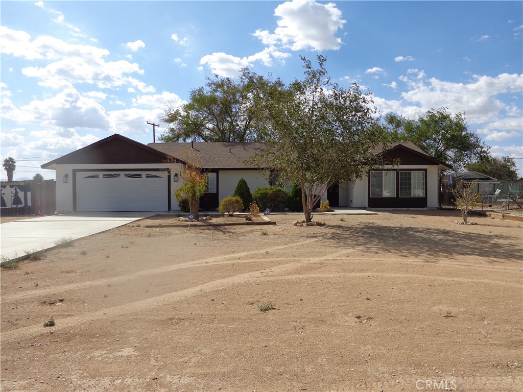 12744 Running Deer Road Apple Valley, CA 92308 - Photo 2 of 30 a front view of a house with a yard