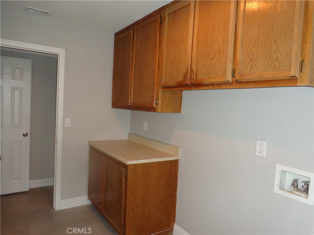 12744 Running Deer Road Apple Valley, CA 92308 - Photo 23 of 30 a utility room with dryer and washer
