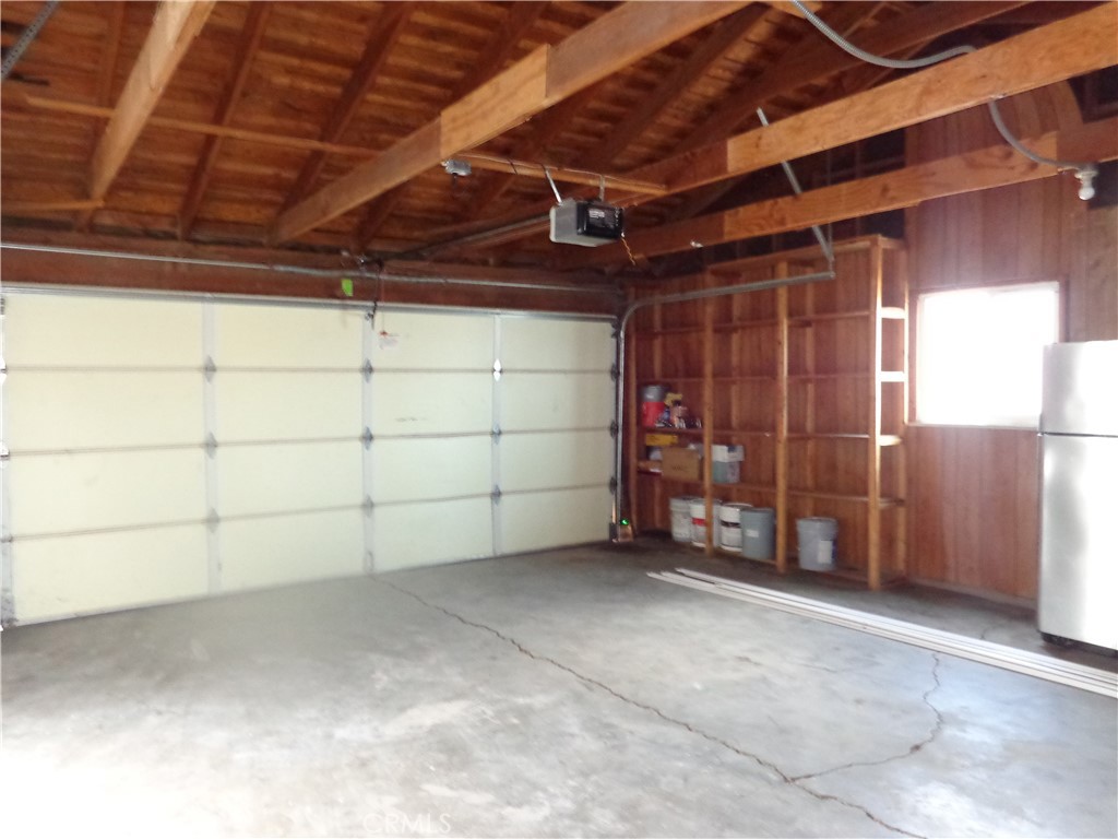 12744 Running Deer Road Apple Valley, CA 92308 - Photo 25 of 30 a view of a room with wooden walls