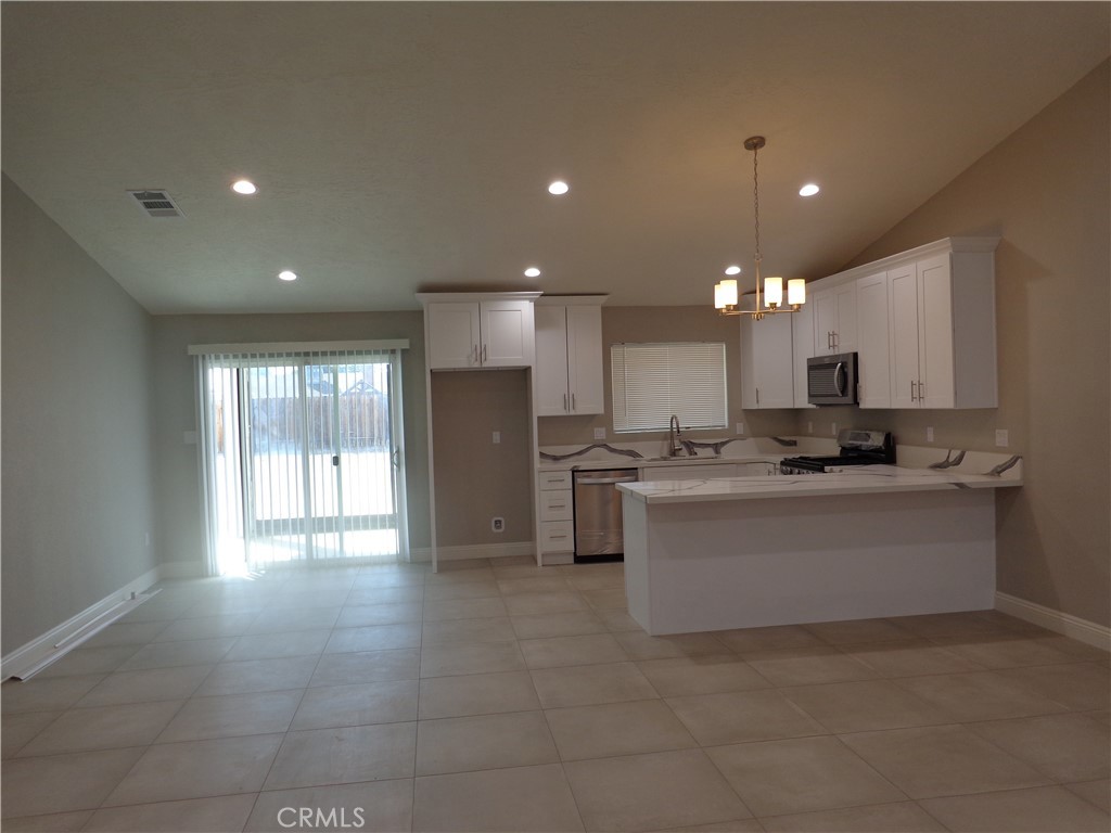 12744 Running Deer Road Apple Valley, CA 92308 - Photo 4 of 30 a view of kitchen with windows