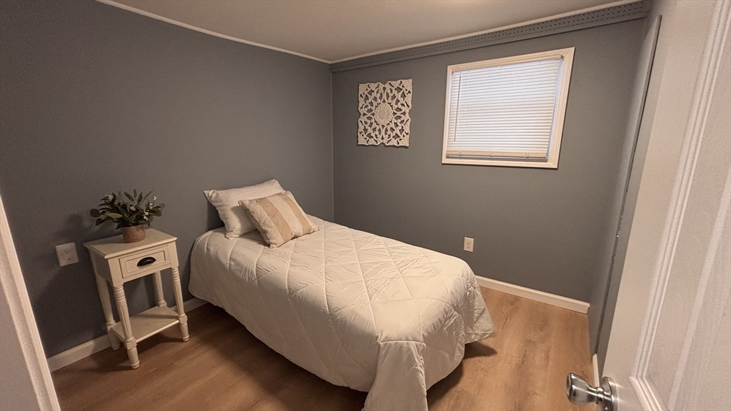 229 Miller Street, Unit G3 Ludlow, MA 01056 - Photo 12 of 12 a bedroom with a bed and a window