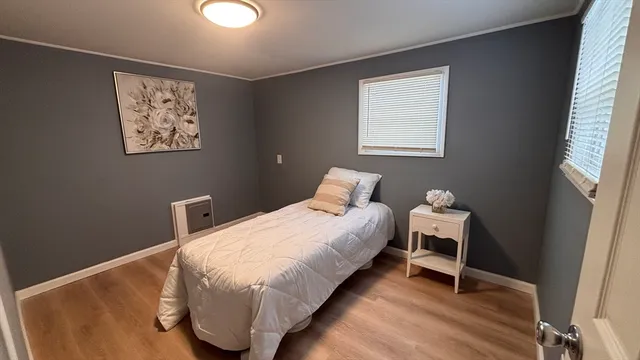 a bed room with a bed and a window