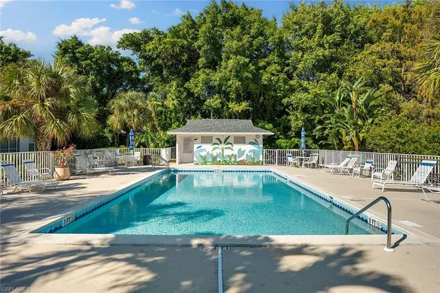a view of a swimming pool with a patio