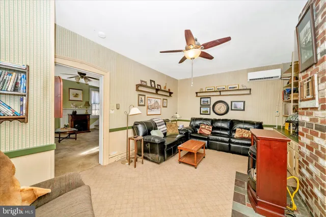 a kitchen with stainless steel appliances kitchen island granite countertop a refrigerator and a stove