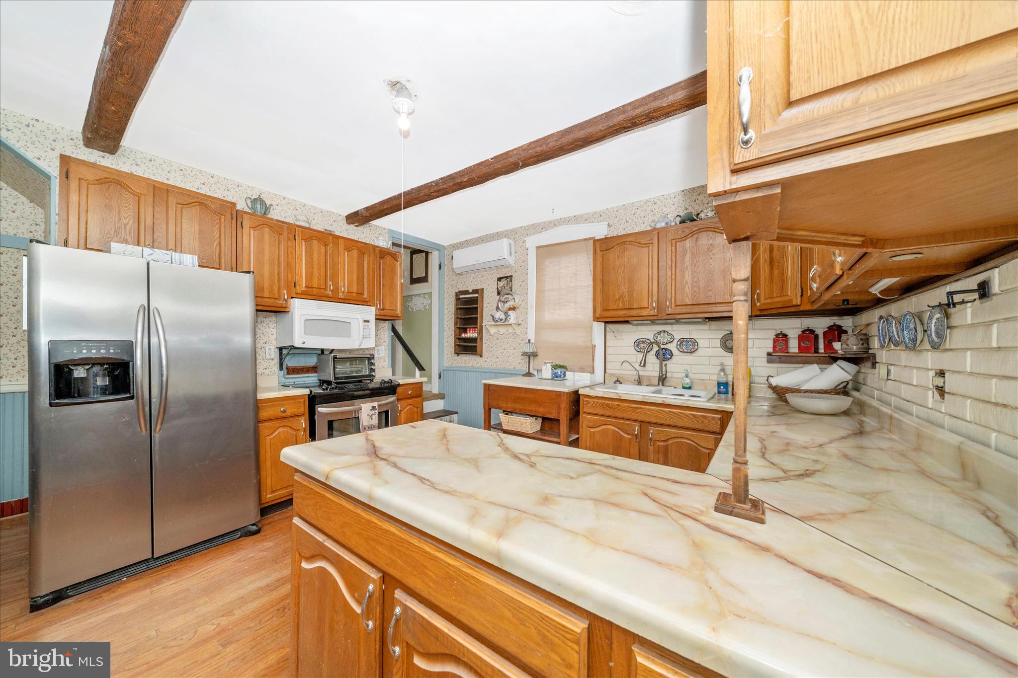 6710 Ford Road Frederick, MD 21702 - Photo 14 of 62 a kitchen with stainless steel appliances kitchen island granite countertop a refrigerator and a stove