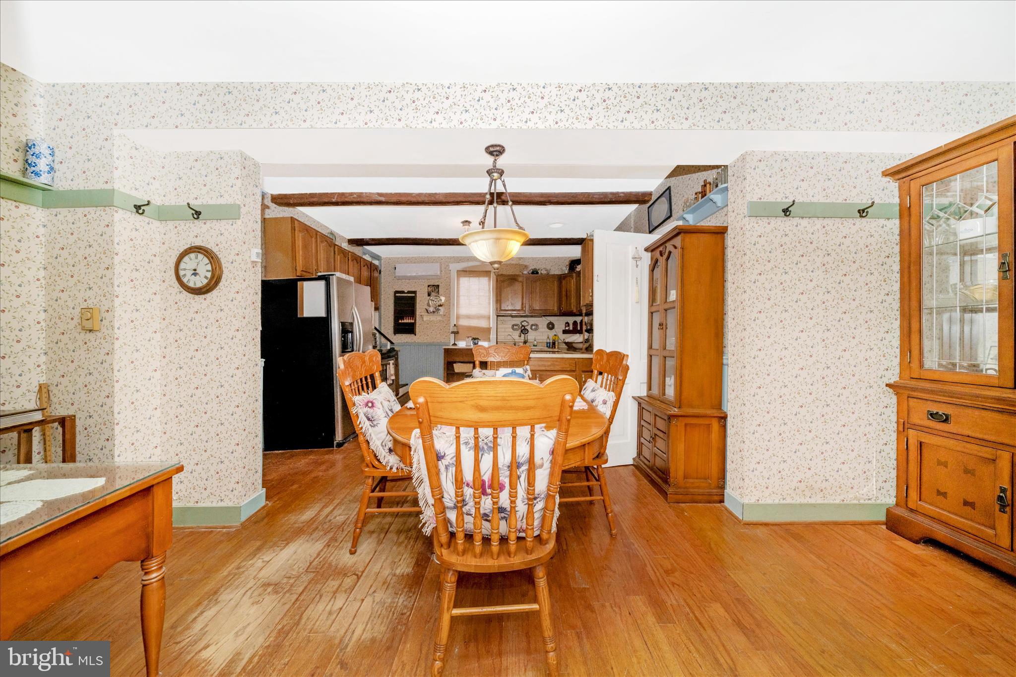 6710 Ford Road Frederick, MD 21702 - Photo 22 of 62 a dining room with furniture a chandelier and wooden floor