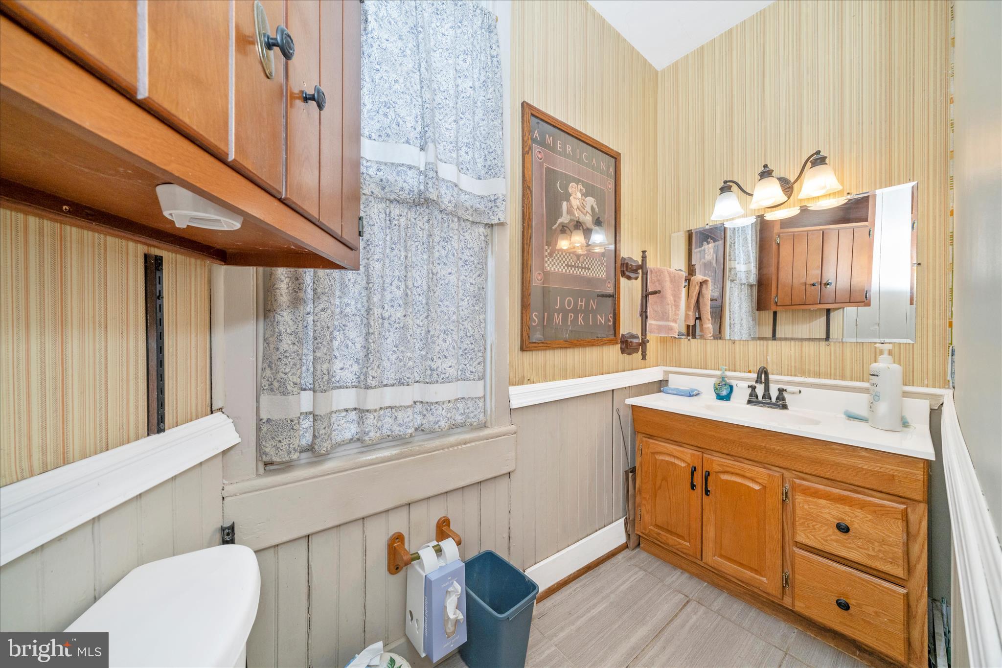 6710 Ford Road Frederick, MD 21702 - Photo 29 of 62 a spacious bathroom with a sink a mirror and a toilet