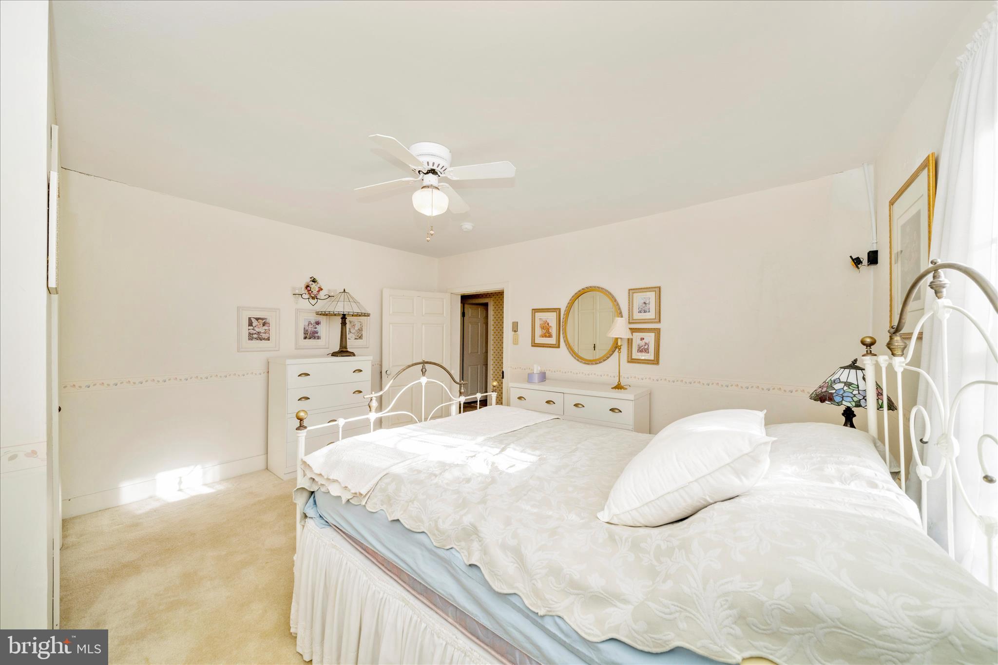 6710 Ford Road Frederick, MD 21702 - Photo 36 of 62 a bedroom with a bed and a chandelier