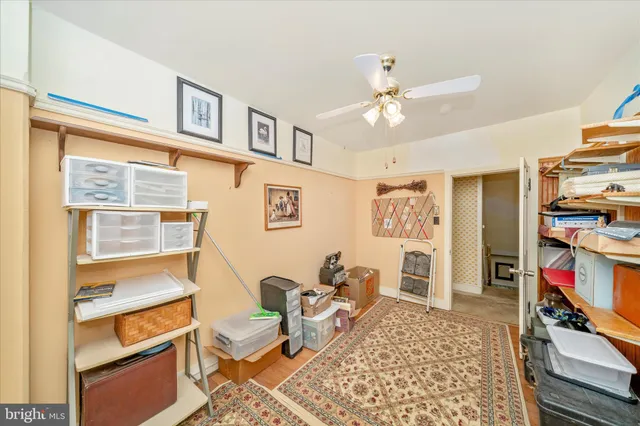 a view of a yard with yellow lighting