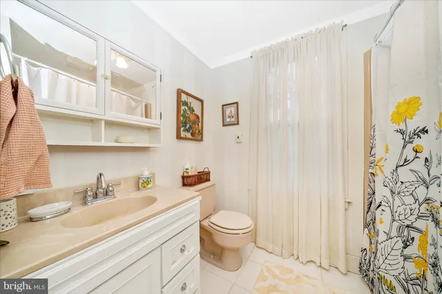 a view of a house with snow on the road