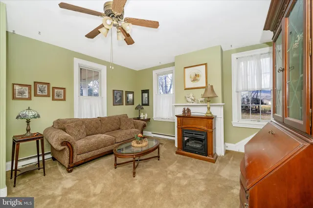 a living room with furniture and a gym equipment
