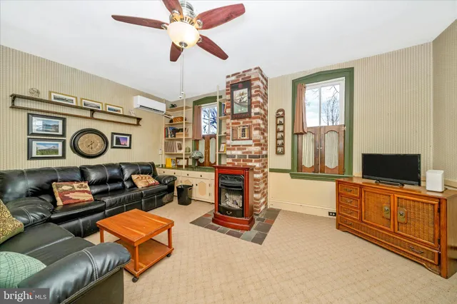 a bedroom with furniture and a window