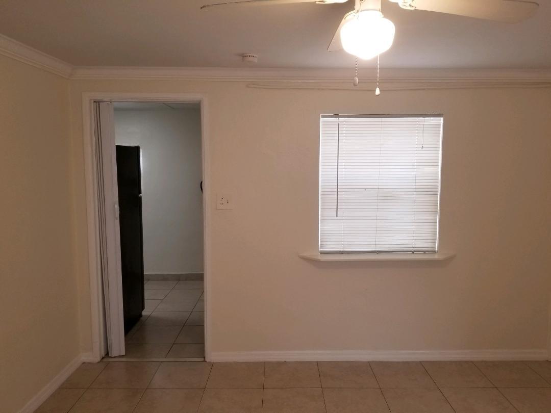 5856 Garfield Street, Unit 2 Hollywood, FL 33021 - Photo 11 of 11 a view of an empty room with a window