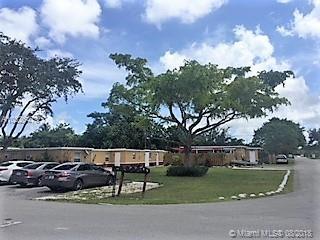 5856 Garfield Street, Unit 2 Hollywood, FL 33021 - Photo 4 of 11 a view of street with parked cars